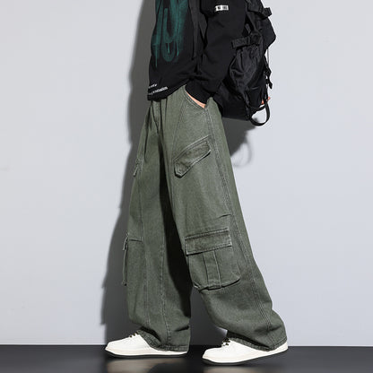 Person wearing green cargo pants with a plain background