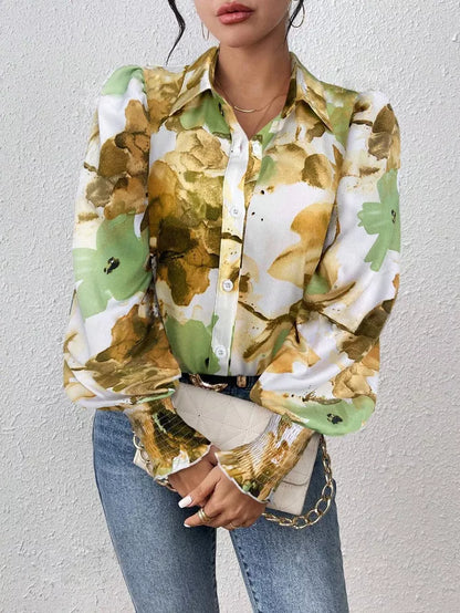 Person wearing a multicolored patterned shirt with a plain background
