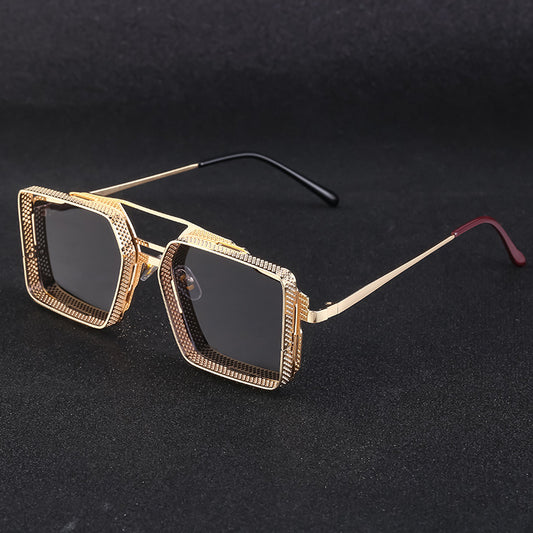 Gold-framed sunglasses on a black background