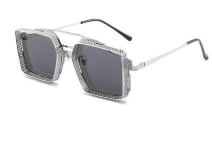 Silver sunglasses with a geometric frame on a white background