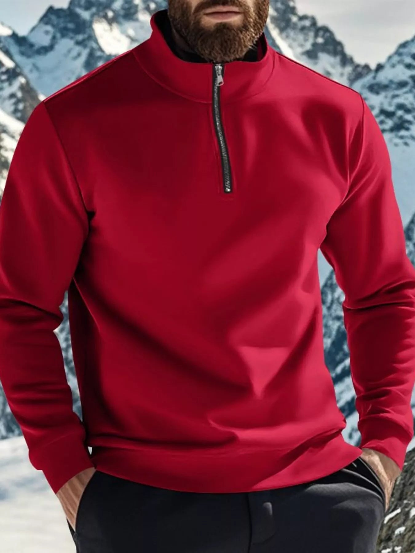 Person wearing a red pullover with a mountainous background