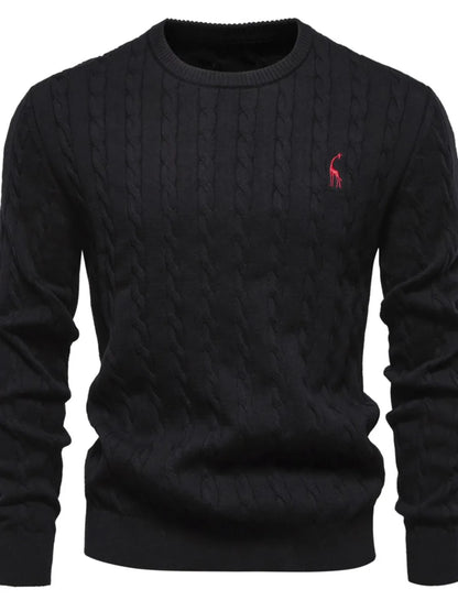 Black cable knit sweater with a red logo on a white background