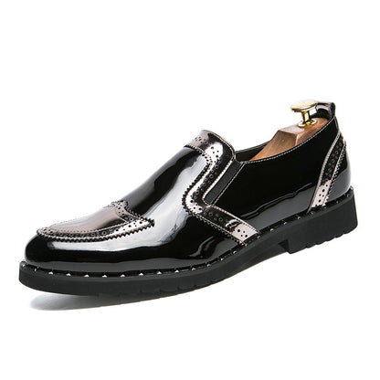 Black shoes with silver accents on a white background