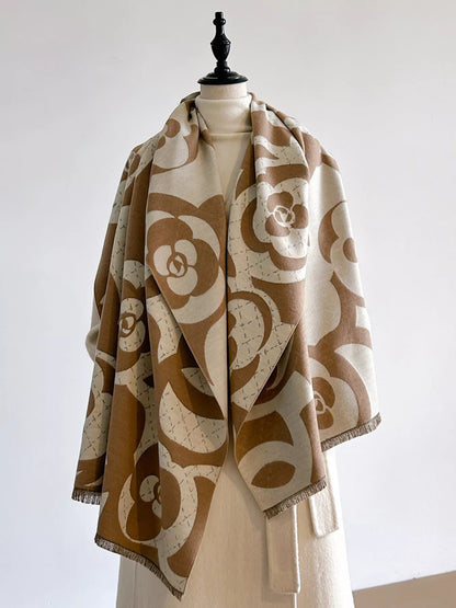 Patterned scarf draped over a mannequin against a plain background