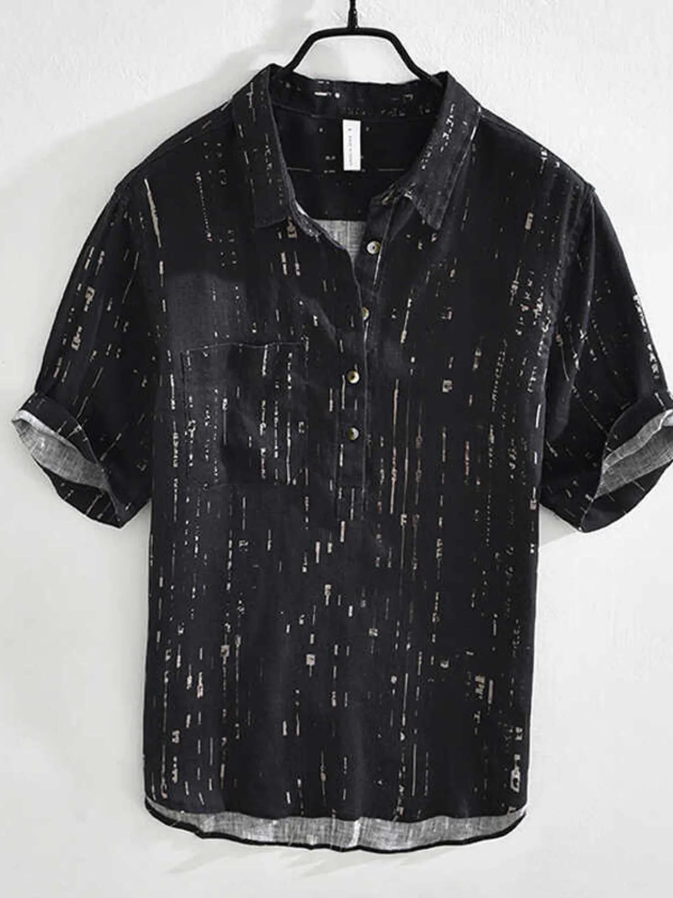 Black short-sleeve shirt with subtle pattern on a white background