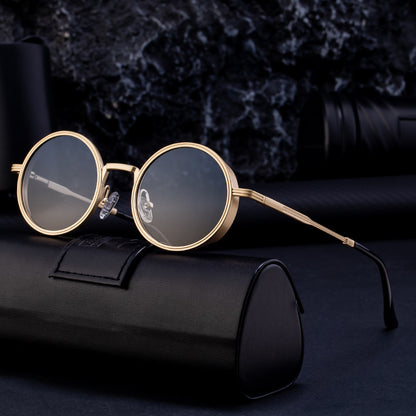 Round gold-framed sunglasses on a black case with a dark textured background