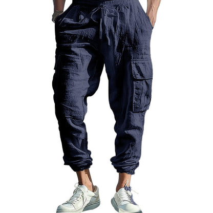 Navy blue cargo pants worn by a person on a white background