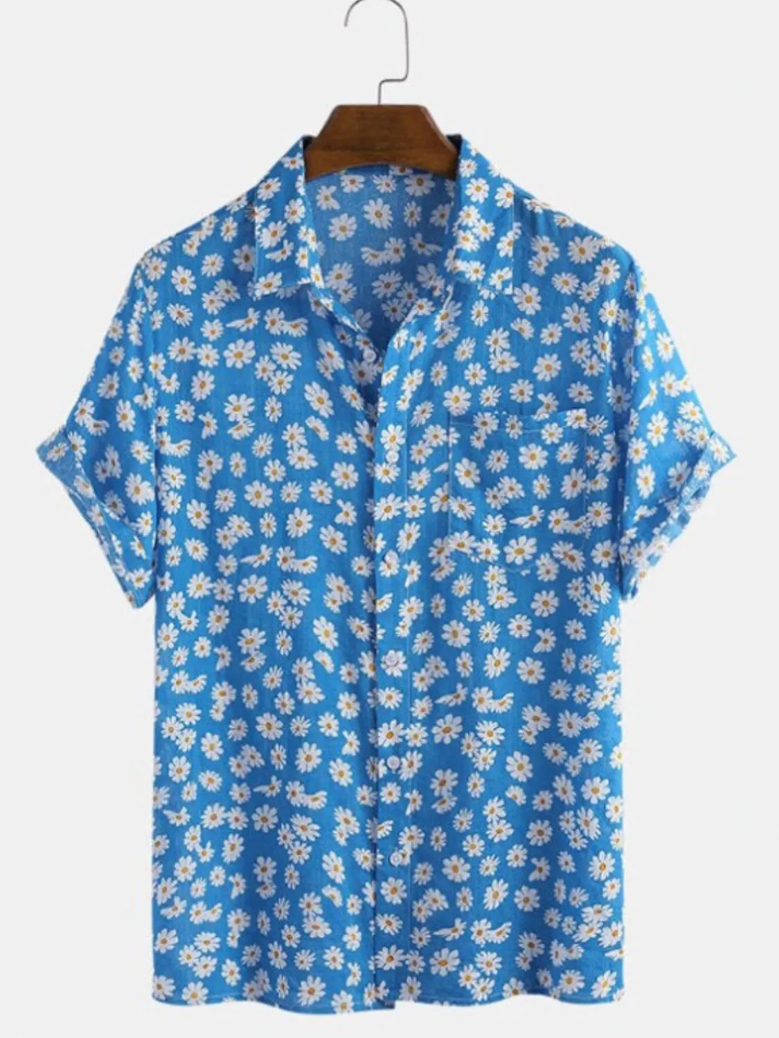 Blue floral shirt on a hanger against a white background