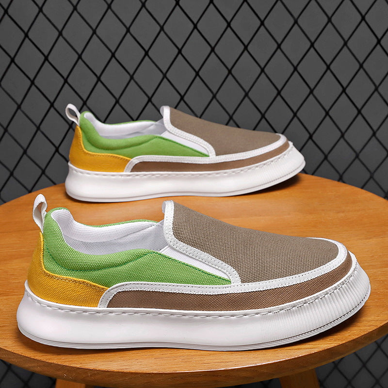 Colorful slip-on sneakers on a wooden table with a dark textured background