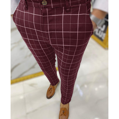 Maroon checkered pants worn by a person on a light background