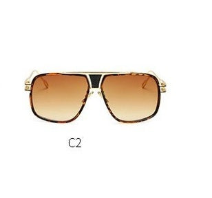 Sunglasses with gold frame and brown gradient lenses on a white background