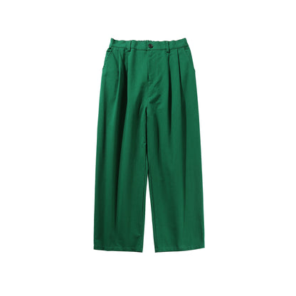 Green pleated pants on a white background