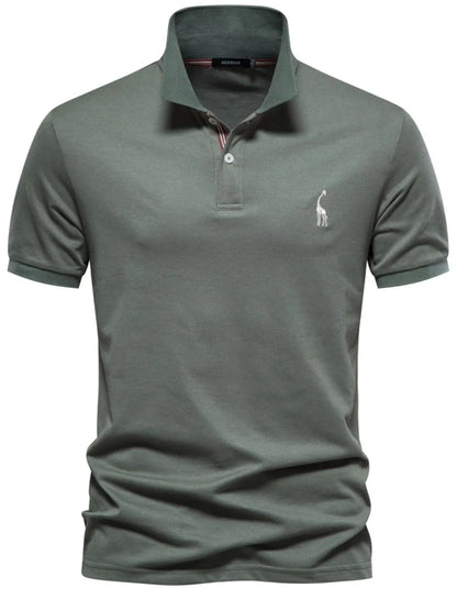 Green polo shirt with a small logo on a white background