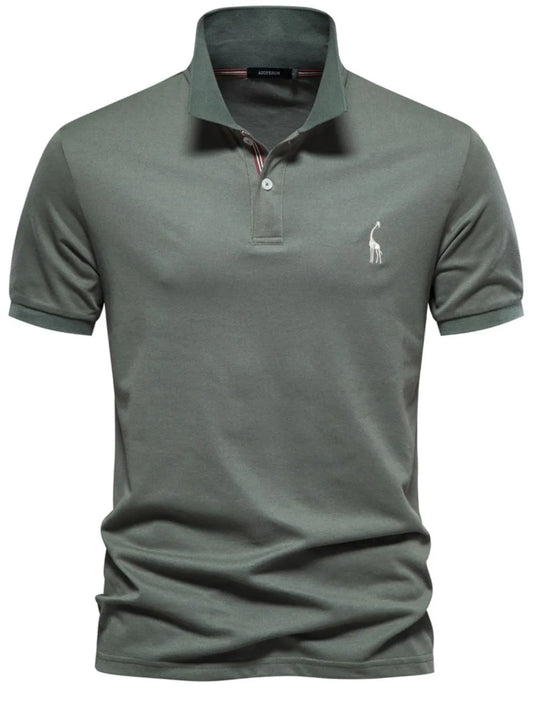 Green polo shirt with a small logo on a white background