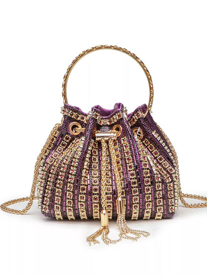 Purple handbag with gold accents on a white background