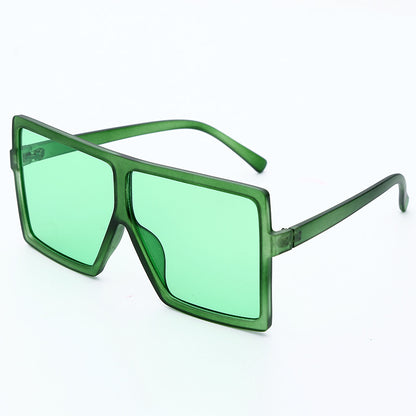 Green sunglasses with a white background