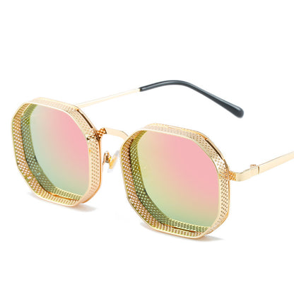 Gold-framed sunglasses with pink and green gradient lenses on a white background