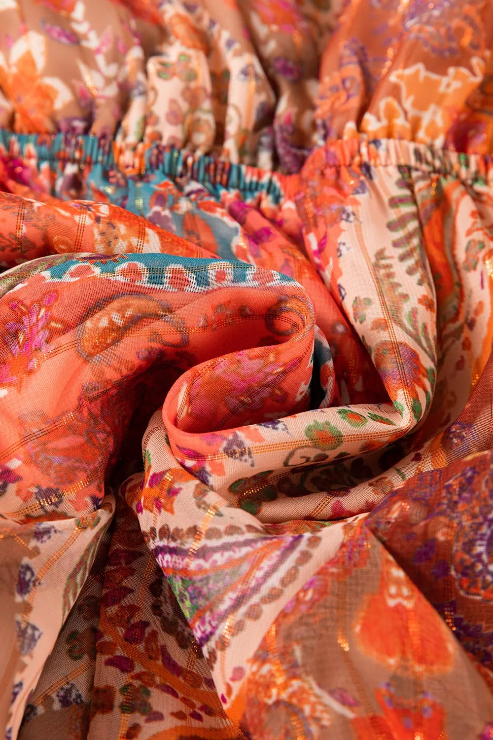 Close-up of colorful patterned fabric with a focus on texture and color.